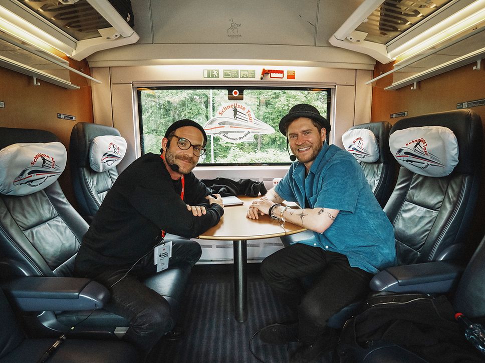 Sebastian E. Merget und Johannes Oerding im ICE